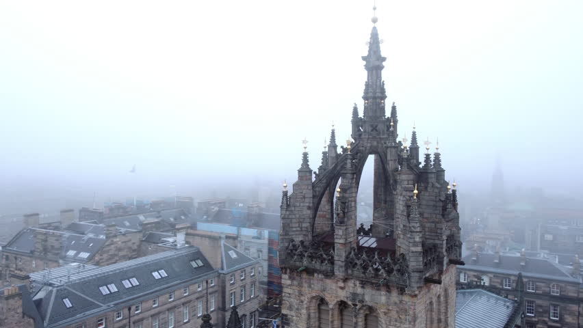Aerial view away from the Saint Giles cathedral, in foggy Edinburgh, Scotland