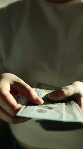  Man hold us money, counting one hundred dollar bills. Saving concept. High quality FullHD footage
