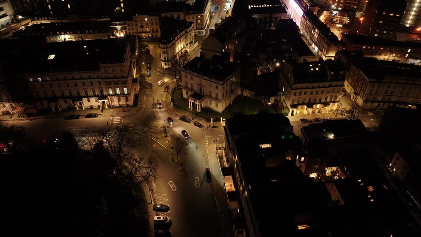 Aerial View Of Belgrave Square District In London At Night, Street Lights Illuminating Buildings And Cars Moving