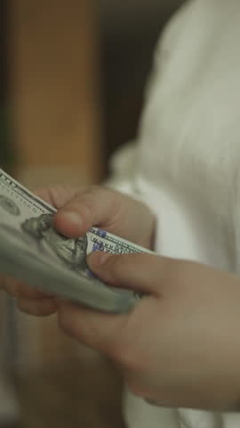  Man hold us money, counting one hundred dollar bills. Saving concept. High quality FullHD footage