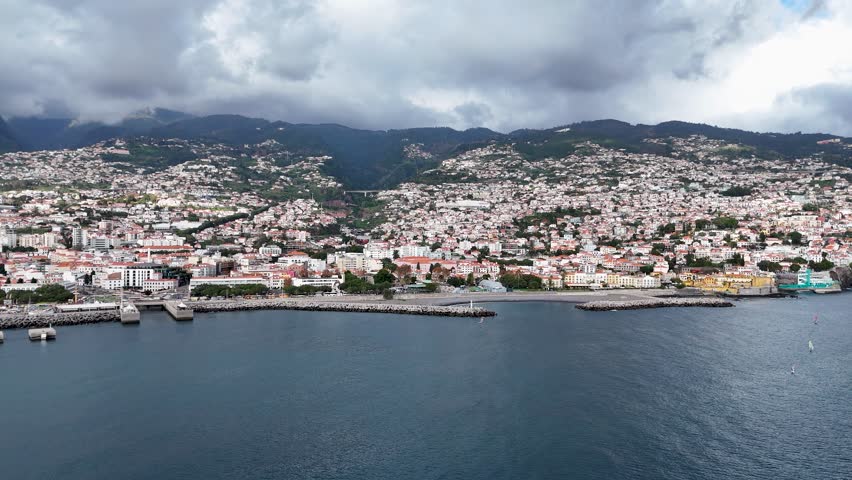 Coastal Cityscape with Boats on the Ocean and Mountain Backdrop, Madeira Island, Portugal
