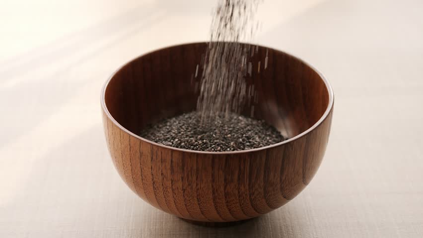 Nutritious chia seeds filling bowl with healthy grains Perfect for promoting healthy eating and balanced diet Healthy eating habits start with chia seeds rich in nutrients and essential minerals