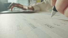 Macro close up of accountant woman working with laptop computer analyzing financial report and data statistics documet in office. Unrecognizable businesswoman checking company balance sheet statement. - Powered by Shutterstock - Get 15% off with code: PIKWIZARD15