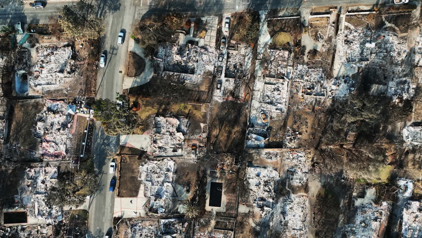 Birdseye drone view over fire damage in Altadena, golden hour in Los Angeles, USA