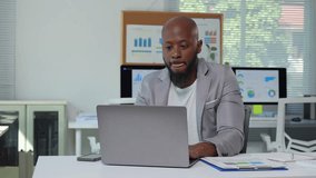 Professional business executive experiencing growing stress while reviewing financial reports. Displaying increasing frustration and anxiety during challenging work moment in corporate office setting - Powered by Shutterstock - Get 15% off with code: PIKWIZARD15