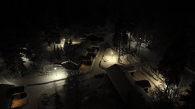Aerial view of a illuminated cabin village, winter evening in Kainuu, Finland - Powered by Shutterstock - Get 15% off with code: PIKWIZARD15