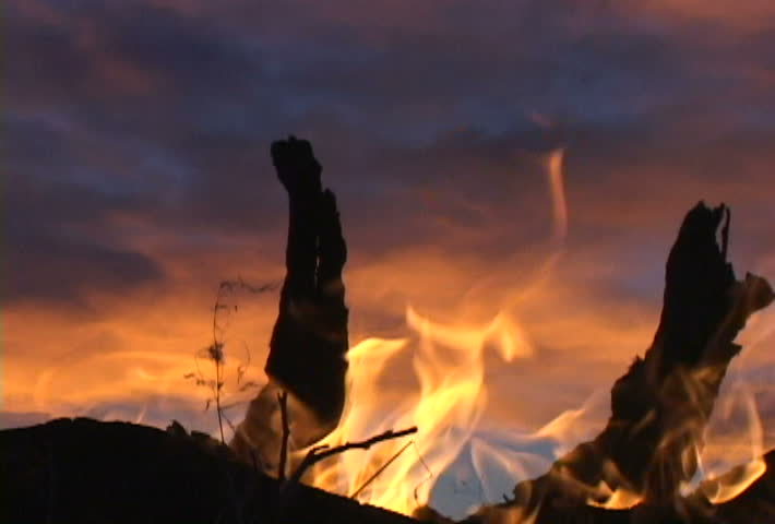 Two clips of camping in Montana at sunset, camp fire scenic.