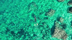 Single man snorkeling in the idyllic turquoise waters of Ibiza, Balearic Islands - Powered by Shutterstock - Get 15% off with code: PIKWIZARD15