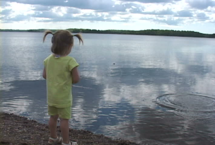 Young girl enjoys a perfect day at the lake.
