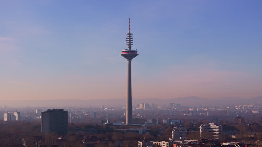 Aerial panorama of Frankfurt skyline featuring Europaturm telecommunication tower, metropolitan architectural prominence from overhead vantage point
