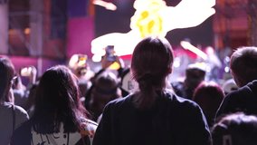 Lot teens dance kpop music concert. Many young men fans cheering fun party. Joy crowd teenagers hang out cool night life fest, k pop chill. Epic live arena. Neon disco light. People enjoy band song. - Powered by Shutterstock - Get 15% off with code: PIKWIZARD15