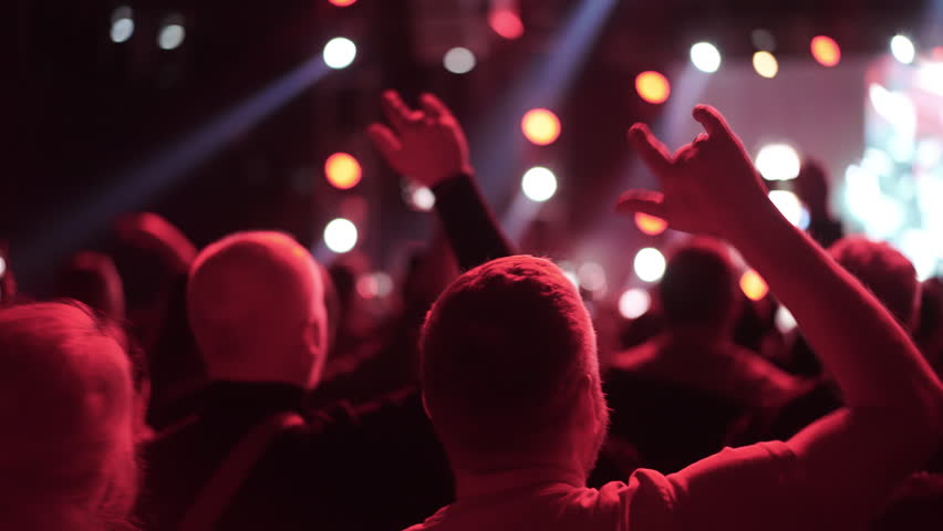 Lot people enjoy rock roll music concert. Many men fans cheer fun heavy metal party. Joy crowd hang out cool night life fest, rave chill. Epic live arena. Neon light. Hip hop band song. Punk jam gig.