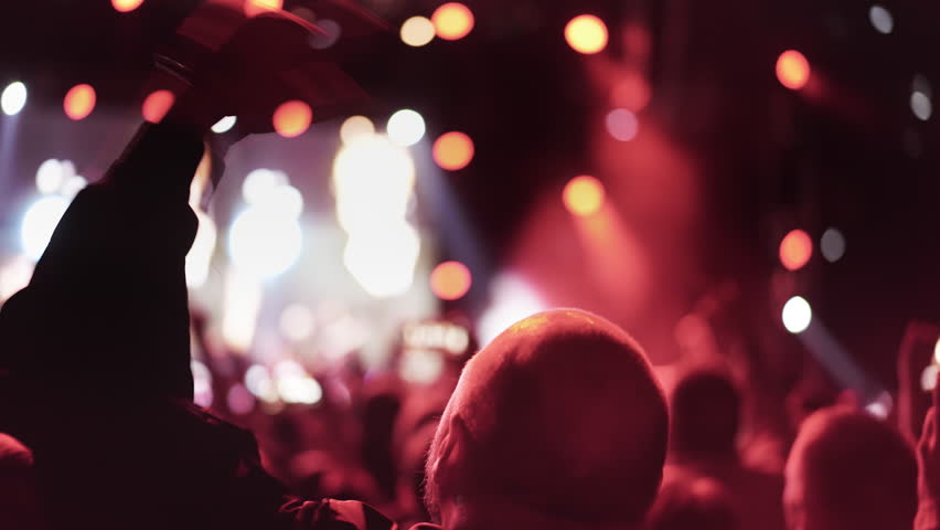 Lot people enjoy rock roll music concert. Many men fans cheer fun heavy metal party. Joy crowd hang out cool night life fest, rave chill. Epic live arena. Neon light. Hip hop band song. Punk jam gig.