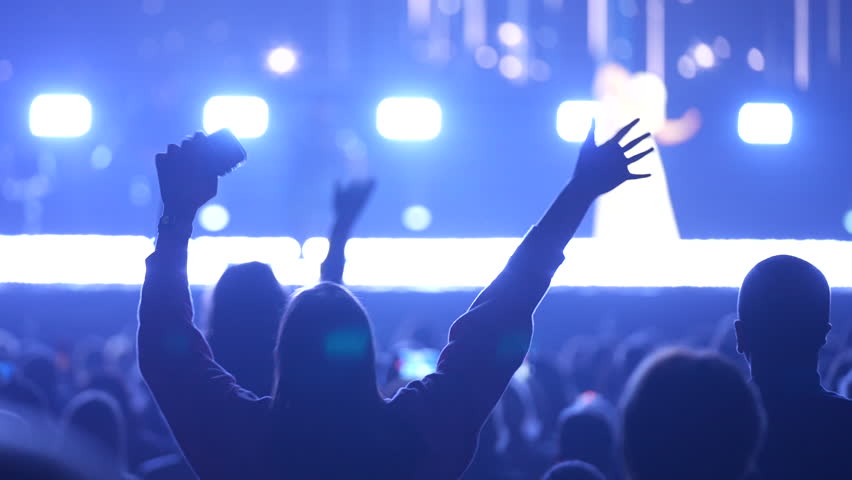 Lot teens dance kpop music concert. Many girls fans cheering fun party. Joy crowd teenagers hang out cool night life fest, k pop chill. Epic live arena. Neon light. People enjoy song. Dancer energy.