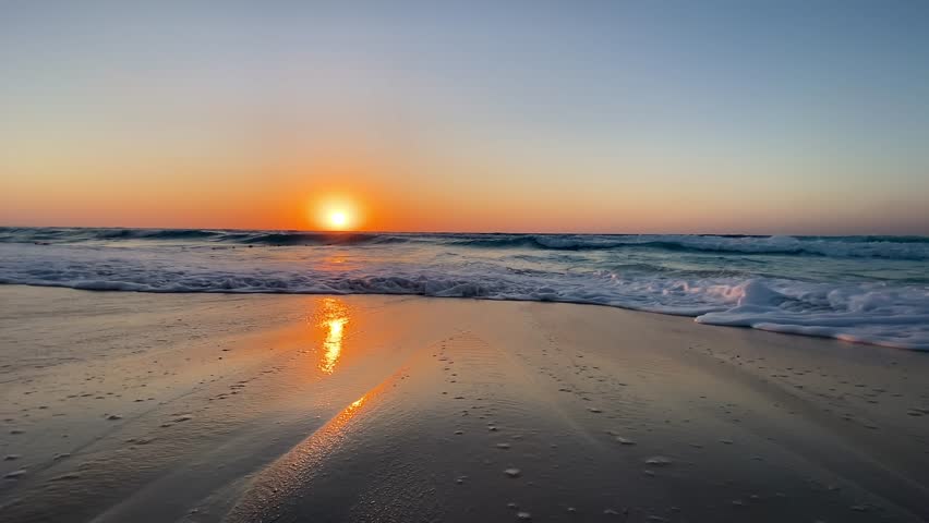 Sea horizon and scenic sunset over splashing ocean waves and beach shore, tropical landscape. Tropical sea sunset and waves on exotic beach in north beach in egypt.