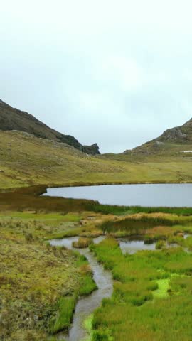 vertical video from a Drone Laguna in the mountains.Natural lagoon tourism and travel concept. Healthy lifestyle. Peru lagoons. World