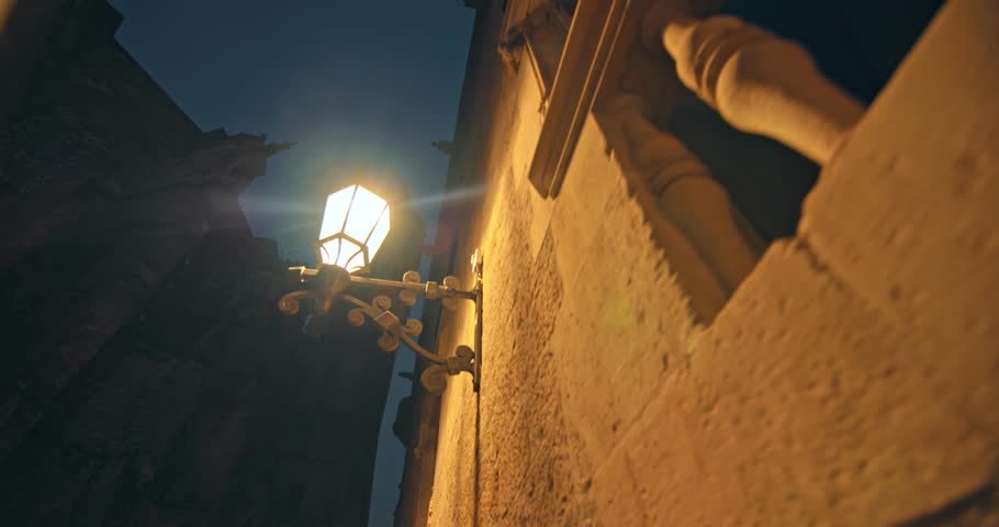 Mysterious night streets of the Gothic Quarter in Barcelona: Narrow alleys, historic buildings, and soft streetlights highlight Catalonia medieval charm in Spain. High quality 4k footage