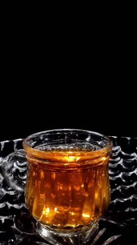 Slow Motion Shot of Droplets Falling into the Glass in a Bowl Vertical Video Stock Footage 1080