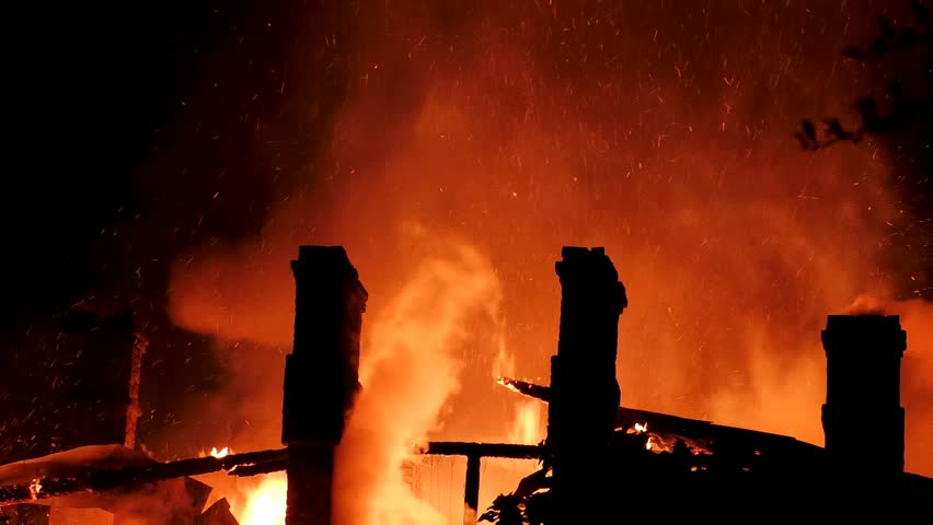 A big fire burns down the house. A fiery tragedy, The building is burning from the inside, flames are everywhere, complete destruction by fire.