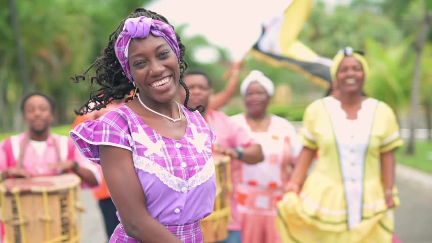 Portrait of a beautiful girl from the Garifuna ethnic group wearing a beautiful traditional costume in lilac color.