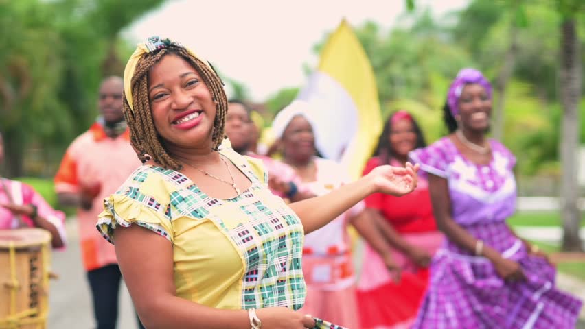 Beautiful Latina girl of the Garifuna ethnic group dances to the rhythm of the music.
