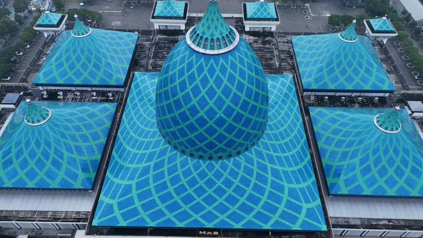 Aerial video of the al-Akbar National Mosque in Surabaya, Indonesia. The text in the video means: al-Akbar National Mosque Surabaya.