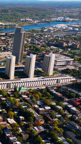 Aerial view of the surroundings and tall buildings house the state government workers in Empire Plaza, Albany. Vertical video.
