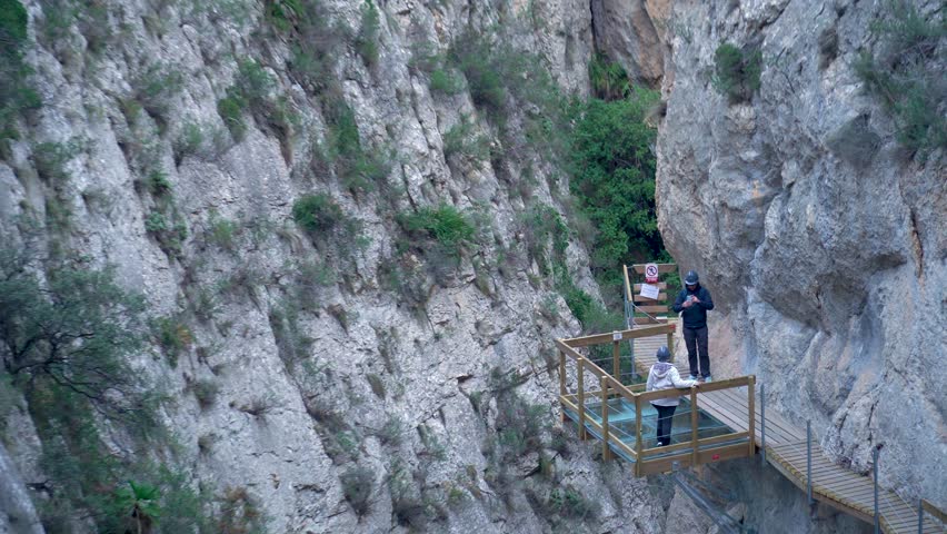 Slow motion. People on the gorge walkways. In Relleu, Alicante, Comunidad Valenciana (Spain).	