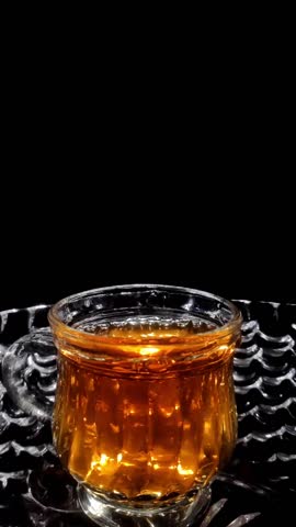 Slow Motion Shot of Droplets Falling into the Glass in a Glass Bowl Vertical Video Stock Footage 1080