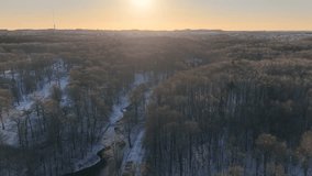 Aerial sunset view of small creek in winter woods, Denmark - Powered by Shutterstock - Get 15% off with code: PIKWIZARD15
