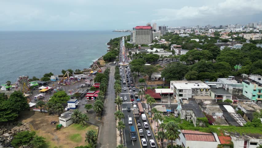 Aerial view of the coastal road Malecón and the iconic obelisk in Santo Domingo in the Dominican Republic on a cloudy summer day