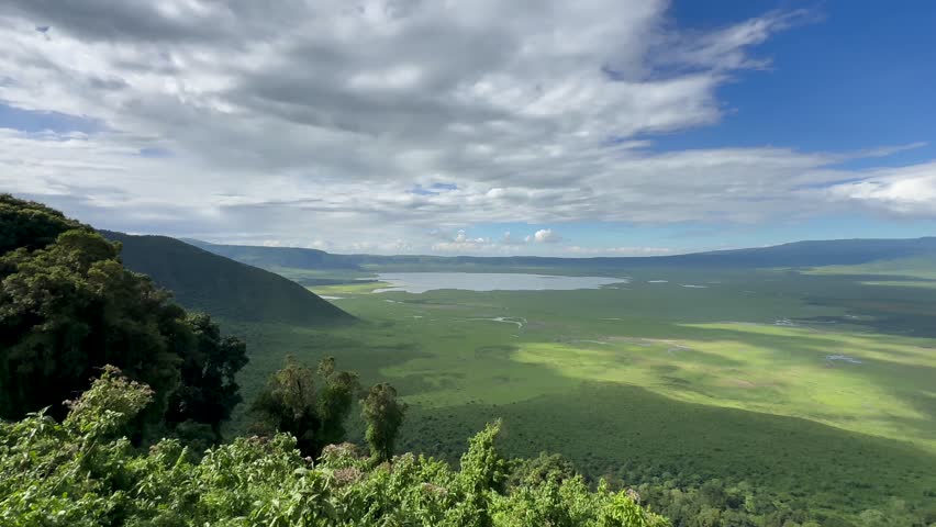 Panoramic view of Ngorongoro Crater from the viewing platform on a sunny day. Tanzania.