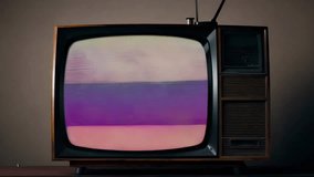 Vintage television set displaying colorful static in retro-styled room. Glitch art tv concept with nostalgic vibe. Visuals relating technology failure. Warm cozy lighting, old-school decor. Past time. - Powered by Shutterstock - Get 15% off with code: PIKWIZARD15
