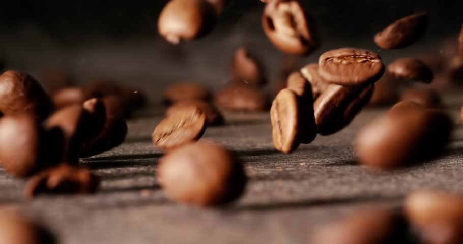 Close up of seeds of coffee. Fragrant coffee beans Super Macro Close Up. Shot on super slow motion camera 1000 fps.