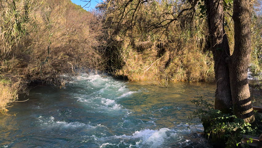 Fast flowing river in winter sunny day at Krka National Park, Croatia
