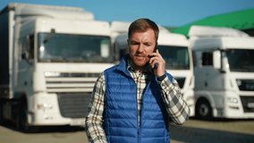 Truck driver talking on smartphone in parking - Powered by Shutterstock - Get 15% off with code: PIKWIZARD15