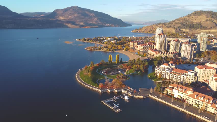 Downtown Waterfront, Kelowna, BC, Canada. Panorama Calm Okanagan Lake Landscape. British Columbia Interior in the Fall Autumn Season with Colourful Trees. Evening Sunset, City Park Walking Path