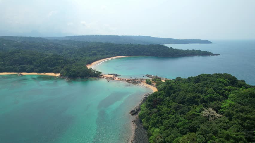 Flying towards the bridge that link Bom bom beach and bom bom Islet in Ilha do Principe, with the beach at background.Sao Tome,Africa