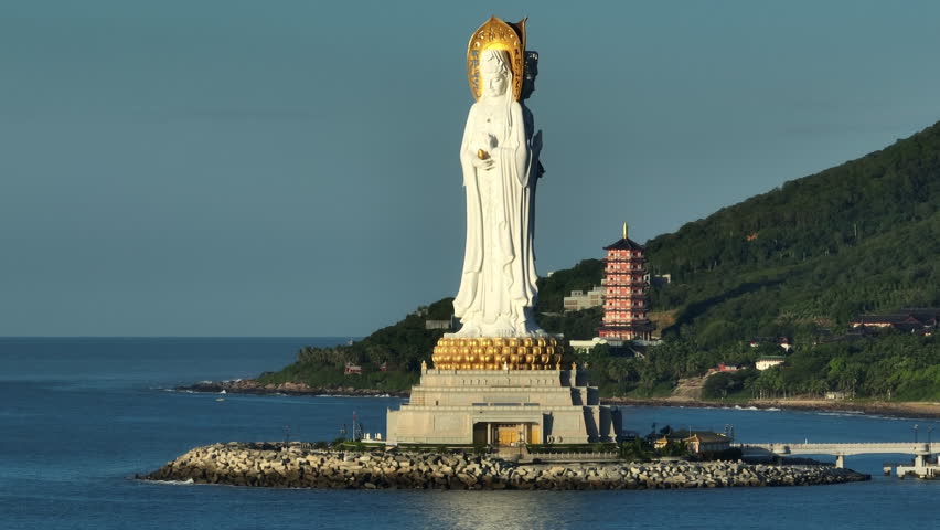 Buddhism Guanyin statue at seaside in nanshan temple, hainan island , China, words mean blessing and mercy