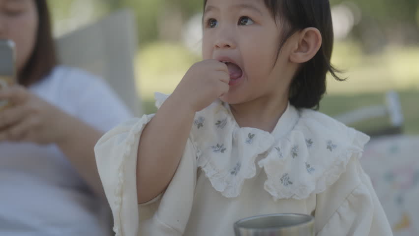 Children play in spring vacation park.Active happy group of kid run with a dog on grass in field in summer.Family in nature with pet.Child on play.Happy family concept.School in garden with dog