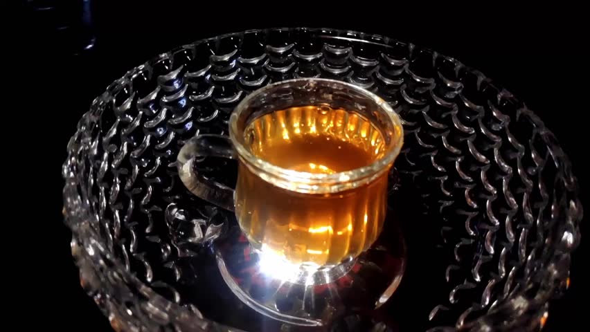 Slow Motion Shot of Tea Drops While Pouring into the Glass Video Stock Footage 1080