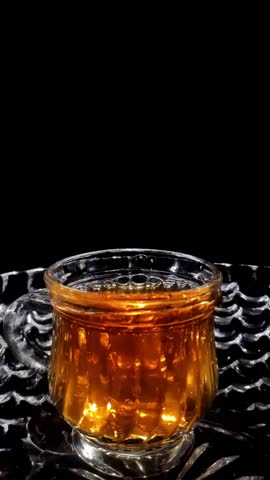 Slow Motion Shot of Droplets Falling into the Glass in a Bowl Vertical Video Stock Footage 1080