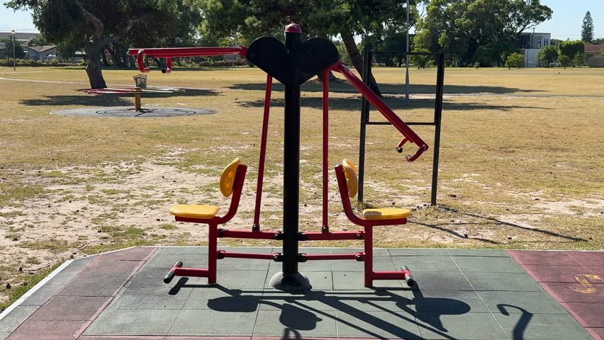 A gym machine for resistance training in an outdoor park in Cape Town.