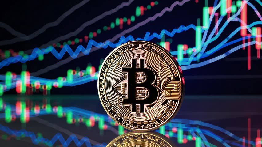 A glowing, gold-toned Bitcoin coin sits prominently on a sleek, reflective surface, its intricate design and engraved 'B' symbol shimmering under the ambient neon lights.