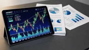 A sleek digital tablet displaying a vibrant financial graph with fluctuating stock market trends and growth indicators rests on a modern office desk. - Powered by Shutterstock - Get 15% off with code: PIKWIZARD15