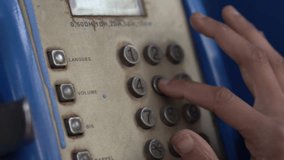 Close-up of a woman using vintage rotary phone in an old telephone booth. Female hand dialing number on antique payphone to call. Retro phone call, nostalgic communication, classic telephone. - Powered by Shutterstock - Get 15% off with code: PIKWIZARD15