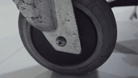 Close-up of luggage trolley wheels at the airport - Powered by Shutterstock - Get 15% off with code: PIKWIZARD15