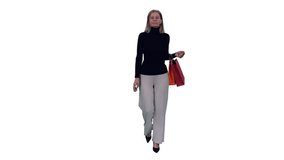 Elegant slim mid adult woman walking with colorful shopping bags, Full HD footage with alpha transparency channel isolated on white background  - Powered by Shutterstock - Get 15% off with code: PIKWIZARD15