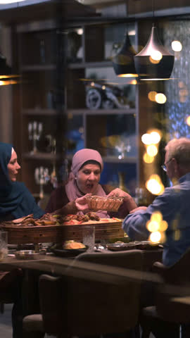 A diverse European Islamic family gathers together for iftar to break fasting during Ramadan, embracing cultural harmony and unity over Middle Eastern cuisine, warm lighting, Eid Mubarak dua time