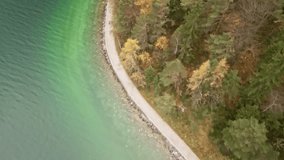 A breathtaking reveal drone shot at Achensee, moving from bottom to top. The shot unveils the vibrant turquoise, clear waters of this stunning alpine lake. - Powered by Shutterstock - Get 15% off with code: PIKWIZARD15
